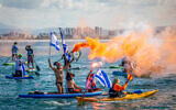 Israelis on boats protest the government's planned judicial overhaul, at the sea in Haifa, northern Israel, March 9, 2023 (Shir Torem/Flash90)