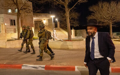 Israeli security forces scan the settlement of Beitar Illit, in the West Bank, following a suspected infiltration of a man who placed a makeshift bomb on March 10, 2023. (Yonatan Sindel/Flash90)
