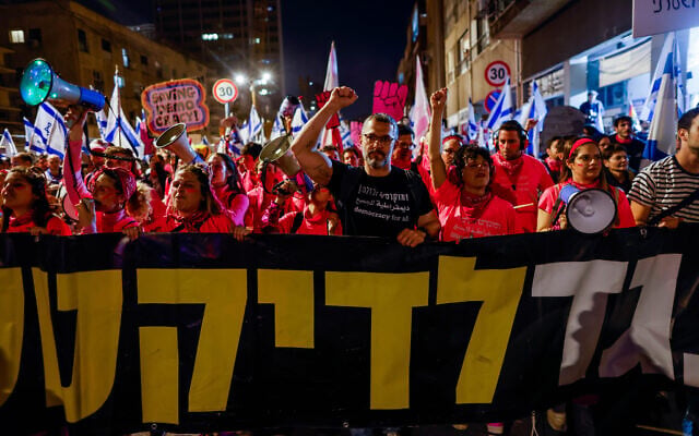 Israelis protest against the government's planned judicial overhaul, in Tel Aviv, on March 11, 2023. (Erik Marmor/Flash90) Israelis protest against the government's planned judicial overhaul, in Tel Aviv, on March 11, 2023. (Erik Marmor/Flash90)