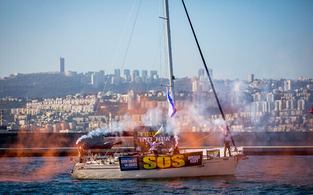 Israelis on boats protest against the government's planned judicial overhaul, at the sea in Haifa, northern Israel, March 16, 2023. (Shir Torem/Flash90)