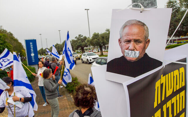 Protesters against coalition members and the judicial overhaul outside a conference in Airport City, March 22, 2023 (Flash90 ) Protesters against coalition members and the judicial overhaul outside a conference in Airport City, March 22, 2023 (Flash90 )