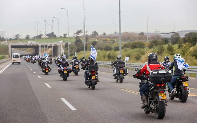 A convoy of motorcycles with Israeli flags as part of a protest against the judicial overhaul, in Herzliya, on March 23, 2023 (Yossi Aloni/Flash90) A convoy of motorcycles with Israeli flags as part of a protest against the judicial overhaul, in Herzliya, on March 23, 2023 (Yossi Aloni/Flash90)