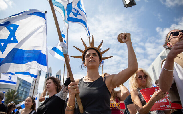 Israelis protest against the government's planned judicial overhaul in Haifa, March 27, 2023. (Shir Torem/Flash90) Israelis protest against the government's planned judicial overhaul in Haifa, March 27, 2023. (Shir Torem/Flash90)