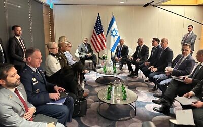 Prime Minister Benjamin Netanyahu sits down with US Defense Secretary Lloyd Austin and other Israeli and American officials at Ben Gurion Airport on March 9, 2023. (Courtesy)