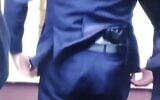 Screen capture from video of Polish Justice Minister Zbigniew Ziobro with a pistol in his belt, March 13, 2023. (Twitter)