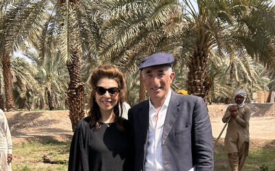 Rick Sopher and his wife Carol planting a date palm in Medina (Courtesy of the Sophers and the Jewish Chronicle)