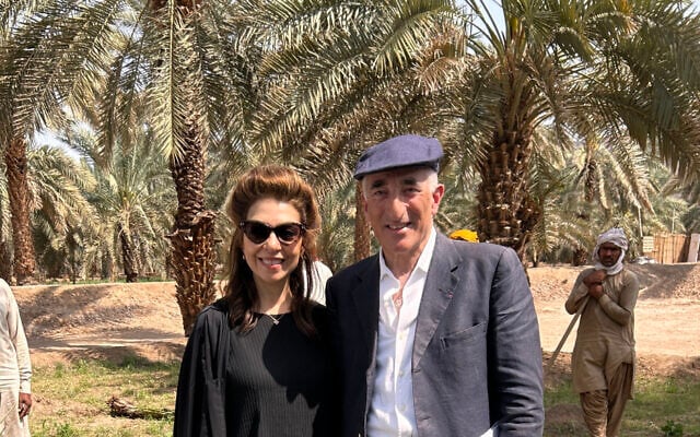 Rick Sopher and his wife Carol planting a date palm in Medina (Courtesy of the Sophers and the Jewish Chronicle)