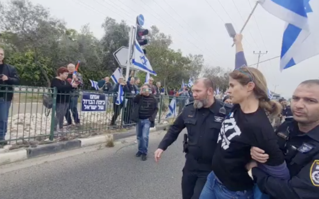 Physicist Dr. Shikma Bressler, co-founder of the Black Flag protest movement is detained, March 23, 2023 (Screen grab) Physicist Dr. Shikma Bressler, co-founder of the Black Flag protest movement is detained, March 23, 2023 (Screen grab)