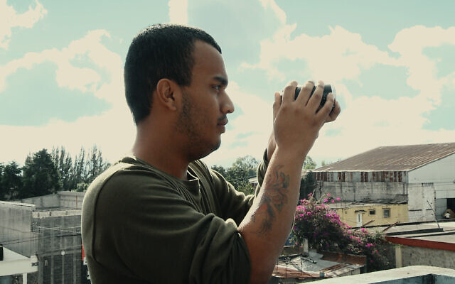 Oren Levy filming with his video camera in a still from 'I am Not.' (Courtesy/ Itai Raziel)