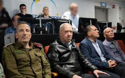 Defense Minister Yoav Gallant (center), Defense Ministry Director-General Eyal Zamir (right) and Deputy IDF chief of staff Amir Baram (left) are seen during the launch of the Ofek-13 reconnaissance satellite, March 29, 2023. (Defense Ministry)