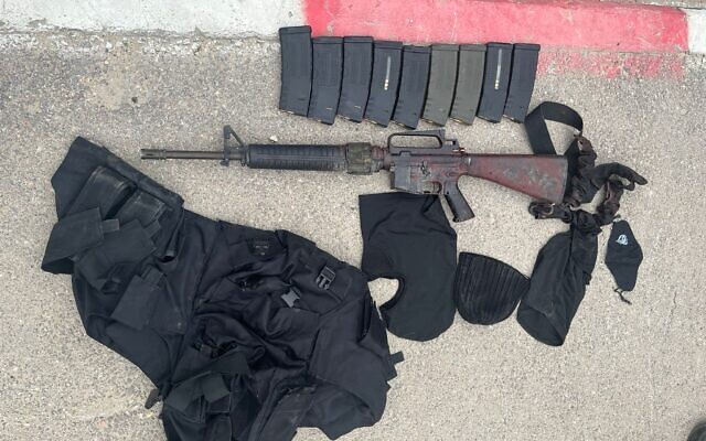 An assault rifle and other military gear seized by Israeli forces from a wanted Palestinian gunman who was killed, March 23, 2023. (Israel Defense Forces) An assault rifle and other military gear seized by Israeli forces from a wanted Palestinian gunman who was killed, March 23, 2023. (Israel Defense Forces)