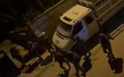 Israeli troops are seen vandalizing a Palestinian truck in the West Bank town of Ni’lin, March 16, 2023. (Screenshot: Twitter)