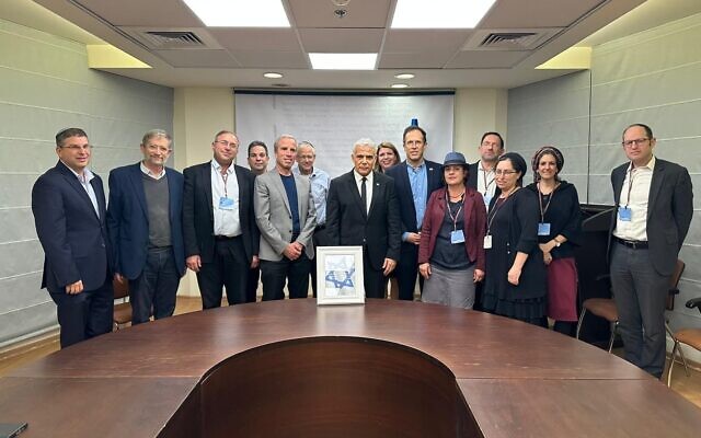 Opposition leader Yair Lapid (C) meets with representatives of the national religious community at the Knesset in Jerusalem on March 13, 2023 (Courtesy Yesh Atid) Opposition leader Yair Lapid (C) meets with representatives of the national religious community at the Knesset in Jerusalem on March 13, 2023 (Courtesy Yesh Atid)