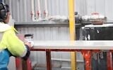 A man works a caesarstone slab (YouTube video screeshot; Used in accordance with Clause 27a of the Copyright Law)