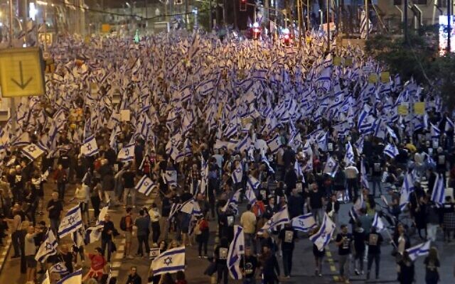 Protesters take part in a demonstration against the government's judicial overhaul plans in Tel Aviv on April 8, 2023. (GIL COHEN-MAGEN/AFP)