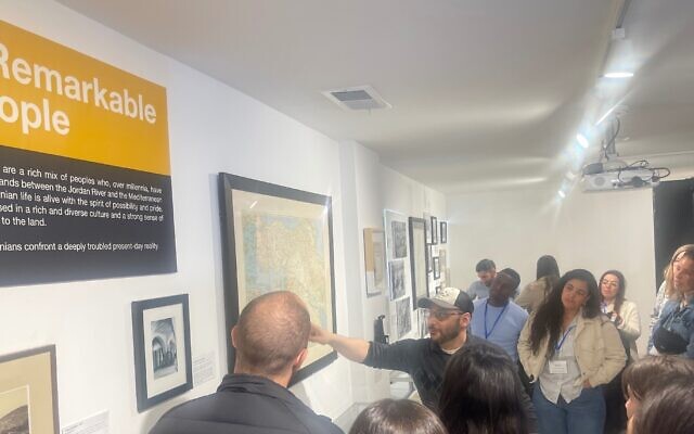 Mohammed El-Khatib, a docent at the Museum of the Palestinian People, leads a group of Jewish Agency emissaries through the museum in Washington, D.C., March 22, 2023. (Ron Kampeas/ via JTA)