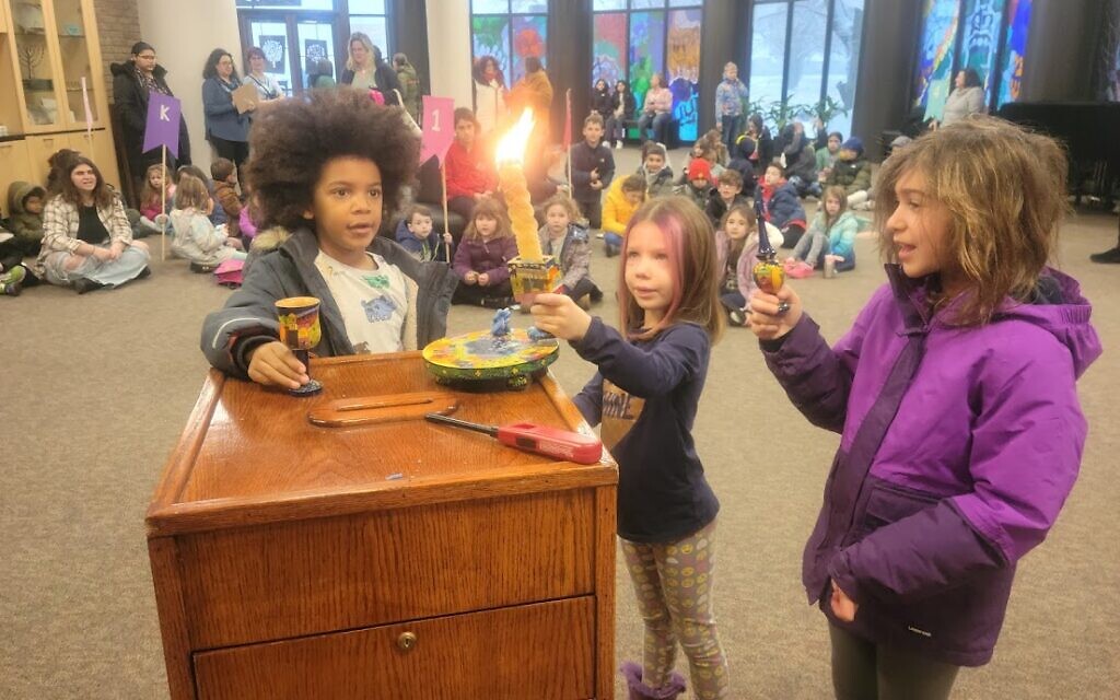 Children light candles as part of their lessons at Yachad Religious School in Oak Park, Michigan. (Courtesy of Yachad via JTA) Children light candles as part of their lessons at Yachad Religious School in Oak Park, Michigan. (Courtesy of Yachad via JTA)