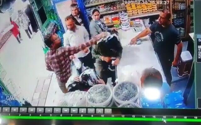 A man pours yogurt on two women for not wearing the hijab, in a shop in Shandiz, Iran, March 2023. (Twitter video screenshot: used in accordance with Clause 27a of the Copyright Law) A man pours yogurt on two women for not wearing the hijab, in a shop in Shandiz, Iran, March 2023. (Twitter video screenshot: used in accordance with Clause 27a of the Copyright Law)