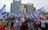 Protesters against the government's judicial overhaul plans demonstrate in Rehovot, where Prime Minister Benjamin Netanyahu was expected to visit the Steakholder factory, April 19, 2023. (Twitter video screenshot: used in accordance with Clause 27a of the Copyright Law)