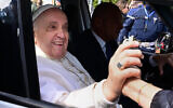 Pope Francis leaves the Gemelli hospital on April 1, 2023 in Rome, after being discharged following treatment for bronchitis. (Tiziana Fabi/AFP)