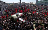 Mourners attend the funeral procession for two of Iran's Revolutionary Guard forces killed in Syria strikes blamed on Israel, held in Tehran on April 4, 2023 (ATTA KENARE / AFP)