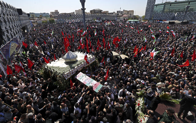 Mourners attend the funeral procession for two of Iran's Revolutionary Guard forces killed in Syria strikes blamed on Israel, held in Tehran on April 4, 2023 (ATTA KENARE / AFP) Mourners attend the funeral procession for two of Iran's Revolutionary Guard forces killed in Syria strikes blamed on Israel, held in Tehran on April 4, 2023 (ATTA KENARE / AFP)