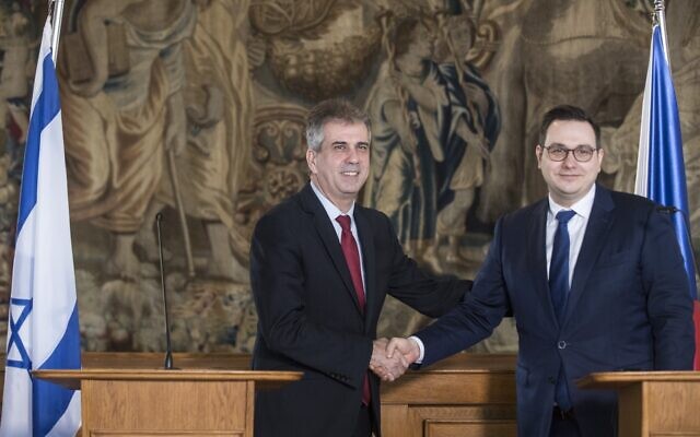 Czech Foreign Minister Jan Lipavsky (R) shakes hands with his Israeli counterpart Eli Cohen after their joint press conference following bilateral talks in Prague, Czech Republic, on April 4, 2023. (Michal Cizek / AFP)