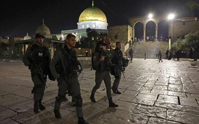 Israeli security forces patrol outside the Dome of the Rock shrine in Jerusalem's Temple Mount compound during Ramadan and Passover, late on April 8, 2023. (Photo by AHMAD GHARABLI / AFP) Israeli security forces patrol outside the Dome of the Rock shrine in Jerusalem's Temple Mount compound during Ramadan and Passover, late on April 8, 2023. (Photo by AHMAD GHARABLI / AFP)