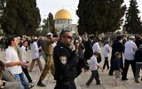 Israeli security forces escort Jewish visitors at the Temple Mount in Jerusalem on April 9, 2023, during the Muslim holy fasting month of Ramadan, also coinciding with the Jewish Passover holiday. (AHMAD GHARABLI / AFP)