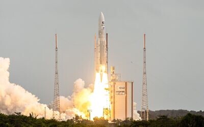 This photograph taken on April 14, 2023, shows Arianespace's Ariane 5 rocket lifting off from its launchpad, at the Guiana Space Center in Kourou, French Guiana. (Jody AMIET / AFP)