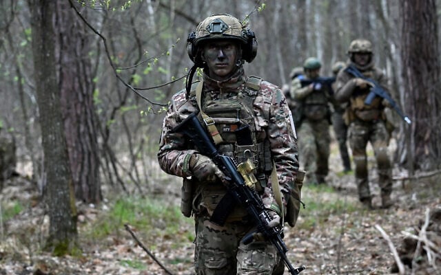 Servicemen belonging to the Ukrainian storm brigade "Bureviy," take part in military exercises outside Kyiv on April 20, 2023. (Sergei Supinsky/AFP) Servicemen belonging to the Ukrainian storm brigade "Bureviy," take part in military exercises outside Kyiv on April 20, 2023. (Sergei Supinsky/AFP)