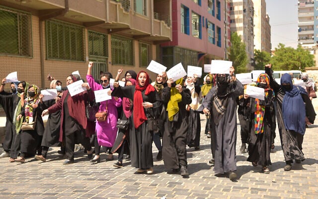 Afghan women hold placards as they march to protest for their rights, in Kabul, Afghanistan, on April 29, 2023. (AFP) Afghan women hold placards as they march to protest for their rights, in Kabul, Afghanistan, on April 29, 2023. (AFP)