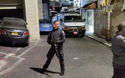 Police at the scene of a shooting in the northern Arab city of Umm al-Fahm, April 2, 2023. (Israel Police).