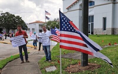 Counter-protesters at a planned neo-Nazi demonstration in Ormond Beach, Florida, thank Volusia County Sheriff Michael Chitwood 'for standing against antisemitism,' April 22, 2023. Chitwood has had white supremacists who have threatened him online arrested and extradited to his county. (Nadia Zomorodian, courtesy of Volusia County Sheriff via JTA)