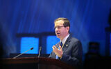 President Isaac Herzog speaks at the Jewish Federations General Assembly in Tel Aviv, April 23, 2023. (Nimrod Gluckman)