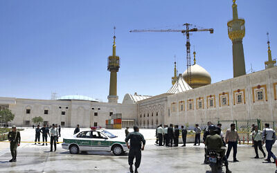 Police officers control the scene, around of shrine of late Iranian revolutionary founder Ayatollah Khomeini, after an assault by several attackers just outside Tehran, Iran, June 7, 2017.  (Ebrahim Noroozi/AP)