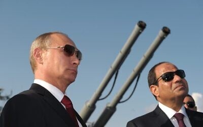 In this file photo taken on Tuesday, August 12, 2014, Russian President Vladimir Putin, left, and Egyptian President Abdel-Fattah el-Sissi, visit missile cruiser Moskva in the Russian Black Sea resort of Sochi, Russia. (Alexei Druzhinin/Sputnik, Kremlin Pool Photo via AP)