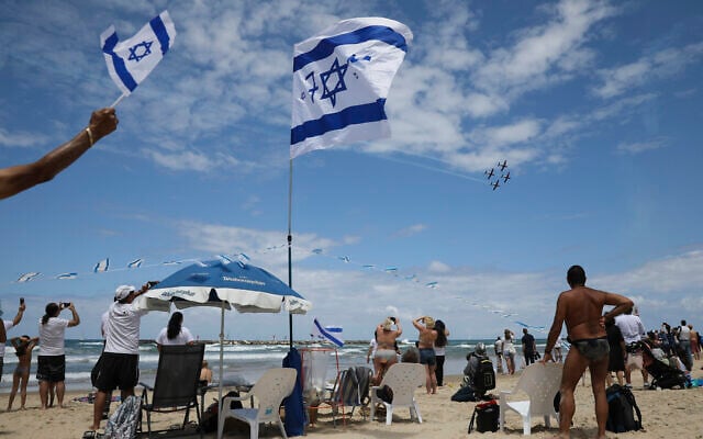 File: Israelis watch an air show during Israel's 71st Independence Day celebrations in Tel Aviv, Israel, May 9, 2019. (AP Photo/Oded Balilty)