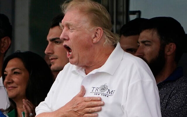 Illustrative: Former President Donald Trump, right, belts out "God Bless America" at the 16th tee during the final round of the Bedminster Invitational LIV Golf tournament in Bedminster, N.J., Sunday, July 31, 2022. (AP/Seth Wenig) Illustrative: Former President Donald Trump, right, belts out "God Bless America" at the 16th tee during the final round of the Bedminster Invitational LIV Golf tournament in Bedminster, N.J., Sunday, July 31, 2022. (AP/Seth Wenig)