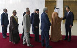 File: Syrian President Bashar Assad (right) receives a delegation representing various Arab parliaments in Damascus, February 26, 2023. (SANA via AP)