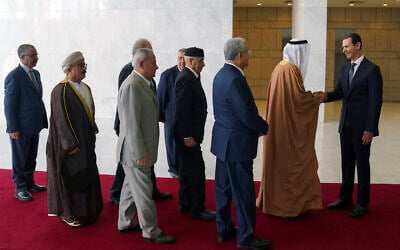 File: Syrian President Bashar Assad (right) receives a delegation representing various Arab parliaments in Damascus, February 26, 2023. (SANA via AP)