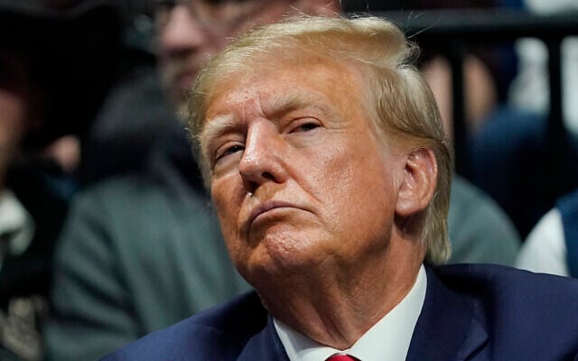 Former US President Donald J. Trump watches the NCAA Wrestling Championships, March 18, 2023, in Tulsa, Oklahoma (AP Photo/Sue Ogrocki) Former US President Donald J. Trump watches the NCAA Wrestling Championships, March 18, 2023, in Tulsa, Oklahoma (AP Photo/Sue Ogrocki)