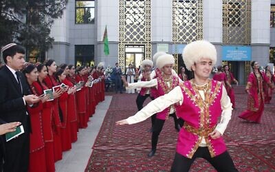 Illustrative: Voters applaud dancers wearing national costume at a polling station in Ashgabat, Turkmenistan, March 26, 2023. (AP Photo/Alexander Vershinin)