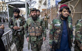 Taliban fighters stand guard at the explosion site, near the Foreign Ministry in Kabul, Afghanistan, Monday, March 27, 2023. (AP Photo/Ebrahim Noroozi)