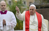 Pope Francis blesses faithful with olive and palm branches before celebrating the Palm Sunday's mass in St. Peter's Square at The Vatican, April 2, 2023. (AP Photo/Filippo Monteforte, pool)