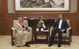 In this picture released by the Iranian Foreign Ministry, Iran's Foreign Minister Hossein Amirabdollahian, right, meets with his Saudi Arabian counterpart Prince Faisal bin Farhan Al Saud in Beijing, April 6, 2023. (Iranian Foreign Ministry via AP)