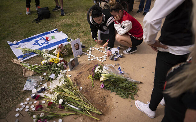 People gather and lay flowers at the site where Alessandro Parini, an Italian tourist, was killed in a suspected terror attack, in Tel Aviv, Israel, April 8, 2023. (AP Photo/Oded Balilty) People gather and lay flowers at the site where Alessandro Parini, an Italian tourist, was killed in a suspected terror attack, in Tel Aviv, Israel, April 8, 2023. (AP Photo/Oded Balilty)