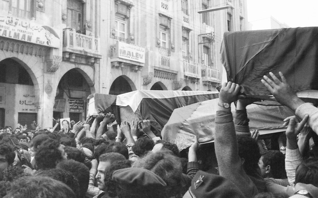 Flag draped coffins of slain Palestinians killed in Israeli raid are taken through the streets of Beirut, Lebanon on April 12, 1973, during the funeral procession. (AP Photo, File) Flag draped coffins of slain Palestinians killed in Israeli raid are taken through the streets of Beirut, Lebanon on April 12, 1973, during the funeral procession. (AP Photo, File)