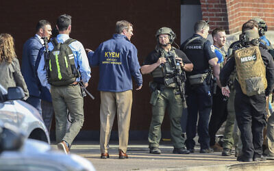 Kentucky Governor Andy Beshear arrives at the scene of a shooting in Louisville, Kentucky, April 10, 2023. (Michael Clevenger/Courier Journal via AP)