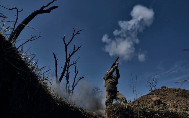 Illustrative -- A Ukrainian soldier fires a grenade launcher on the frontline in Bakhmut, Donetsk region, Ukraine, April 10, 2023. (AP Photo/Libkos) Illustrative -- A Ukrainian soldier fires a grenade launcher on the frontline in Bakhmut, Donetsk region, Ukraine, April 10, 2023. (AP Photo/Libkos)